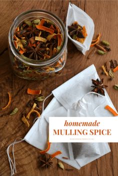 homemade mulling spice in a glass jar on a wooden table with paper napkins