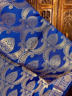 Gorgeous Royal Blue Soft Banarasi Dupatta with muted gold Zari Work. Dupatta is Soft and will add beauty to any Outfit. Please note - The Floral Jaal design might look Sliver zari work however its not sliver its muted gold. Item: DupattaColor : Royal Blue Fabric : Banarasi Silk (Not Pure Silk)Work : Zari Weaved with tassels Size : Full Size DupattaLength of the Dupatta : 92 inches approx.Width of the dupatta : 35 1/2 inches (Approx.)Store Policies- No return or exchange will be accepted for colo Blue Traditional Patterned Blouse Piece For Wedding, Blue Traditional Pattern Blouse Piece For Weddings, Blue Blouse Piece With Traditional Patterns For Wedding, Royal Traditional Wear With Pallu For Eid, Blue Wedding Blouse With Traditional Patterns, Blue Brocade Dupatta With Motifs, Blue Brocade Traditional Wear For Puja, Elegant Blue Blouse With Traditional Patterns, Elegant Blue Blouse Piece With Traditional Patterns