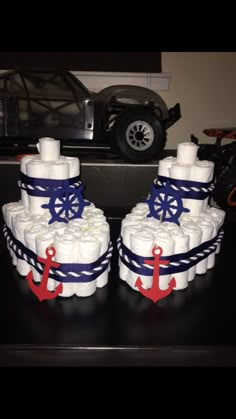 there are two cakes made to look like ships and anchors on top of each other