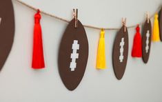 paper footballs and tassels are hung on a string