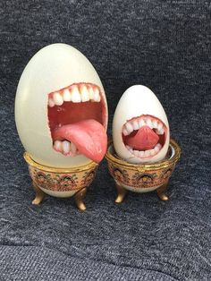 an egg with its mouth open and tongue sticking out from it's inner bowl