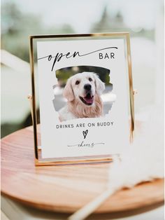 an open bar sign with a dog's face on it and the caption drinks are on buddy