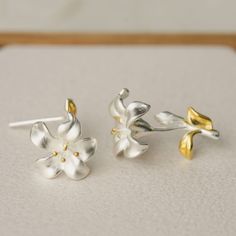 "Lily represents holiness and beauty. In China, lilies are usually used in weddings, implying everlasting love. Check out our lily earrings that are the perfect match for a wedding jewelry or bridesmaids gift. These stunning sets are simple, beautiful, and balance timeless elegance with contemporary style. Each petal is made with great care and they do not only look good on the wearer as stand-alone pieces, you can also compliment other accessories with them to finish off your look for the occas White Earrings For Wedding On Mother's Day, Silver Wedding Earrings With Birth Flower, Sterling Silver Birth Flower Earrings For Wedding, Birth Flower Earrings For Wedding, Wedding Flower Earrings With Birth Flower, White Flower Earrings As Mother's Day Gift, White Flower Earrings For Mother's Day Gift, White Flower Earrings For Mother's Day, White Birth Flower Earrings For Mother's Day