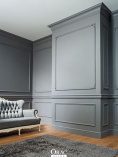 a living room with gray walls and wooden floors