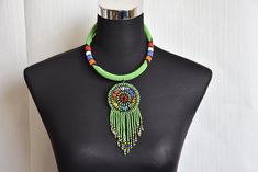 African Beaded Zulu Necklace For Her, Beaded Tribal Wedding Necklace, African  Statement Women  Jewelry, Christmas Gifts Ndebele Necklace  ADDITIONAL ITEMS IN CART SHIP FREE COLOUR : Green    (Available in multiple colors ) DIMENSIONS Pendant Length ; 4 inches SHIPPING INFO We ship via Dhl Express (3-5 days) delivery days. To shop more necklaces  https://www.etsy.com/your/shops/ZolaAfricaCo/tools/listings/section:27148603/733406200 Zolaafricaco home page : ZolaafricaCo.etsy.com Happy shopping. Bohemian Green Beads For Wedding, Zulu Necklace, Necklace For Her, Jewelry Christmas, Wedding Jewellery Necklace, Zulu, Wedding Necklace, Free Coloring, Dhl Express