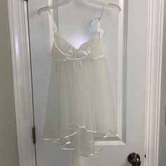 Victoria’s Secret “I Do” Collection Sheer Chemise Slip! Completely See Through, Never Been Worn, Nwt! Perfect Condition! Has A Stunning Silhouette, With A Longer Back And Tulle Bow On The Back! Gorgeous Piece. Size Medium But Could Fit Xs-M! Victoria's Secret White Camisole Sleepwear, White Victoria's Secret Camisole, Victoria's Secret White Lace Sleepwear, Fitted White Victoria's Secret Sleepwear, White Lace Sleepwear By Victoria's Secret, White Victoria's Secret Camisole For Loungewear, Victoria's Secret White Sleepwear For Wedding Night, White Sheer Sleep Camisole, Sheer White Coquette Camisole