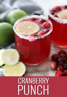 cranberry punch with limes and cherries on the side