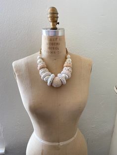 Gorgeous for spring and summer in our classic white. Wooden rings and ball beads wrapped in light cream and white ribbon trim, lace and rickrack. Thanks for looking! White Beach Necklaces For Spring, White Vintage Summer Jewelry, Vintage White Summer Jewelry, Spring Beach White Necklace, White Beach Necklace For Spring, Feminine White Necklace For Spring, Spring White Pearl Necklaces, Elegant Beige Necklaces For Summer, Elegant Beige Necklace For Summer