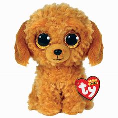 a small stuffed dog with big eyes and a tag on it's collar is shown