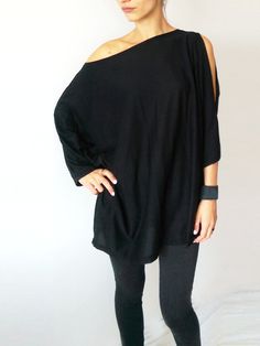 Off The Shoulder Black Women's Tunic with a slot on the Black One-sleeve Party Top, Black Asymmetrical Tunic For Spring, Chic Black Oversized Tunic, Oversized Chic Black Tunic, Oversized Black Chic Tunic, Chic Oversized Black Tunic, Black Oversized Dress For Party, Black Oversized Party Dress, Black Asymmetrical Chic Tunic