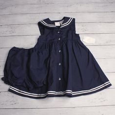 New With Tags Little Goodies Nautical Sailor Dress With Matching Diaper Cover Bloomers 2 Piece Set Sleeveless Square Sailor Collar Button Fasteners Colors: Navy Blue And White Accents: Anchor Buttons And White Trim 65% Cotton 35% Polyester Spring Summer Fall Infant Baby Girl Size 24 Months This Dress Is Slightly Vintage In Age And Is Brand New Without Tags. Spring School Dresses With Buttons, Blue Nautical Spring Dresses, Blue Nautical Cotton Dress, Cotton School Dresses With Buttons, Nautical Cotton Summer Dress, Blue Nautical Dress For Summer, Navy School Dress For Spring, Blue Cotton Sailor Dress, Blue Sailor Cotton Dress