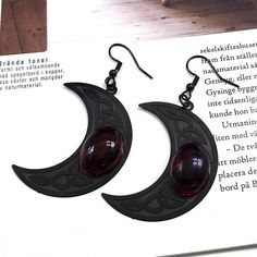 Glimmer in the night with Celtic Moon Witchcraft Earrings! Crafted with stainless steel and aligned with stunning black finishes, these remarkable Gothic earrings will bring a magical, witchy look to your style. Never worry about rust, allergy, fading, or deforming; stainless steel provides anti-acid and anti-alkali protection. Grandeur awaits! 🔮 Black Fantasy Style Pierced Earrings, Black Fantasy Earrings, Black Fantasy Style Earrings, Mystical Nickel-free Black Jewelry, Black Moon Shaped Jewelry For Halloween, Mystical Black Metal Earrings, Witchy Black Nickel-free Earrings, Black Moon-shaped Jewelry For Halloween, Mystical Black Nickel-free Jewelry