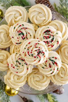 christmas sprinkle cookies on a glass plate