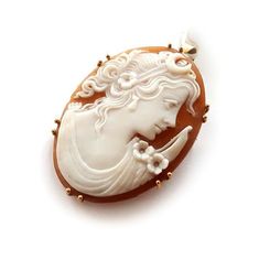 "Shell cameo brooch & pendant featuring Diana goddess profile - in Roman mythology she was the goddess of the hunt, the moon and nature - hand carved from brown Sardonyx seashell and set in 9 kt Gold. Contact me for any other request | Customized works also available. Our cameo tecnique respects the ancient cameo tradition consisting in a shell, gemstone, coral, mother of pearl carved with a design in low relief in which the raised design and the background consist of layers of contrasting c White Oval Cameo Brooches, Collectible Cameo Pendant Brooches, Victorian Style White Cameo Brooch, Victorian Style White Cameo Brooches, Moon And Nature, Diana Goddess, Goddess Of The Hunt, Roman Mythology, Cameo Jewelry