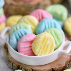 colorfully decorated cookies in a white bowl