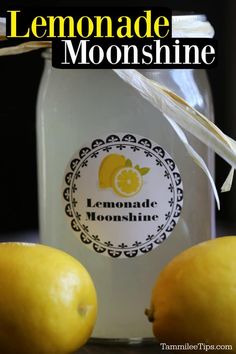 two lemons next to a jar of lemonade on a table with text overlay that reads lemonade moonshine