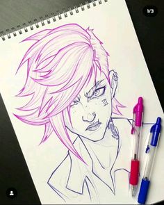 a drawing of a girl with pink hair and two pens on top of a notebook