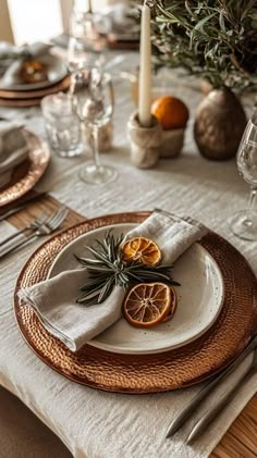 a place setting with an orange slice on the plate