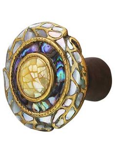 a decorative glass door knob with an ornate design