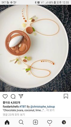 a white plate topped with food on top of a table