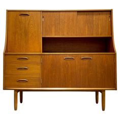 an old fashioned wooden cabinet with drawers