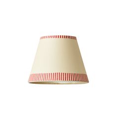 a red and white striped lamp shade on a white background with room for text or image