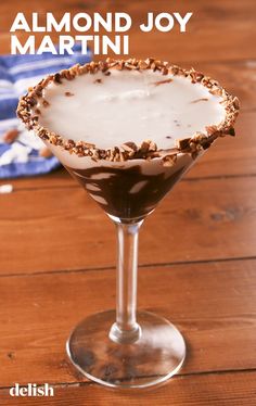 the chocolate martini is ready to be served with almonds on top and topped with whipped cream