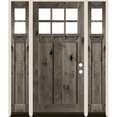 the front door is made from wood and has two sidelights on each side, one with