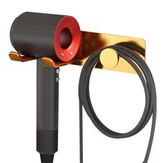 a red and black hair dryer sitting on top of a metal stand next to a hose