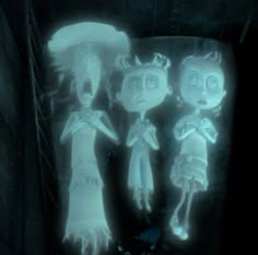 three creepy dolls standing next to each other in a dark room with light coming from the ceiling