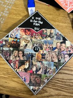 a graduation cap with pictures of people and dogs on it, sitting on a table