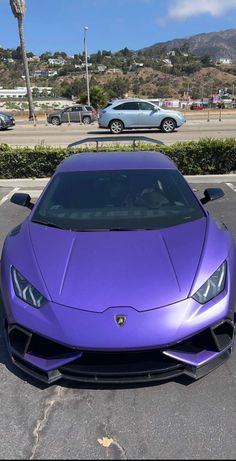 a purple sports car parked in a parking lot