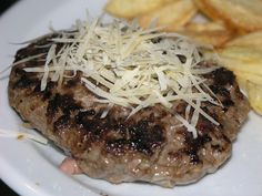 a close up of a plate of food with french fries