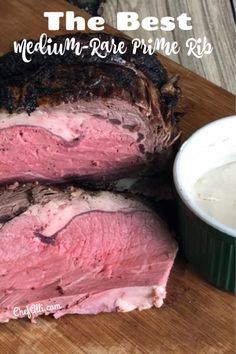 the best medium - rare prime rib roast is served next to a bowl of ranch dressing