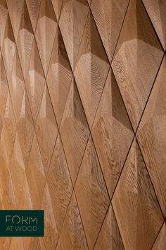 the wooden wall is made up of many different shapes and sizes, including wood panels