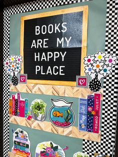 a sign that says books are my happy place on the front of a book shelf