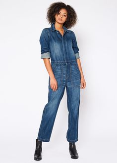 This denim jumpsuit offers a stylish look with reliable comfort. Constructed from 100% cotton, it provides a secure fit while remaining breathable.Model is 5'10" wearing size small. Approx. Body Length: 54 1/2”, Sleeve Length: 23 1/2” Approx. Knee: 19”, Leg Opening: 16 1/2” 100% Cotton Made in USA Fits true to size. Long Sleeve Denim Jumpsuit, Workwear Style, Perfect Denim, Clothing Outfits, Jumpsuit Jacket, Workwear Fashion, Dark Blue Denim, Denim Style, Denim Jumpsuit