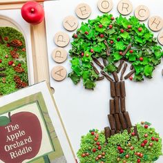 an apple tree made out of wood and letters