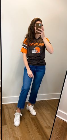 Whether you are a lifelong football fan or a Swiftie attending an NFL game for the first time, this post has 8 simple NFL game day outfit ideas for you. These NFL game outfits are perfect for going to a stadium or for watching the game on TV. Living in Small Town USA for most of my life, I have always been surrounded by football. In the Fall, our weekends are consumed with high school, college, and NFL football. Nfl Game Day Outfit, Football Game Day Outfit, Friendly Outfits, Day Outfit Ideas, Team Sweatshirts, Timeless Outfits, Game Day Outfit