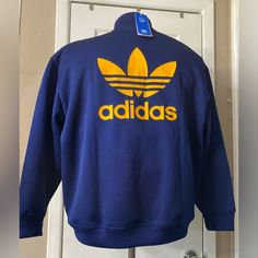 Adidas Originals Adicolor Oversized Quarter-Zip Sweatshirt Sizes: L-Xl S-M 2xxs Color: Navy Blue Code: Ii0747 Sporty Blue Drop Shoulder Tops, Blue Drop Shoulder Sporty Top, Blue Tops With Three Stripes Branding For Streetwear, Blue Three Stripes Top For Streetwear, Oversized Blue Athleisure Sweatshirt, Blue Oversized Athleisure Sweatshirt, Casual Blue Drop Shoulder Sweatshirt, Blue Athleisure Sweatshirt With Three Stripes Branding, Blue Sweatshirt With Three Stripes Branding For Winter