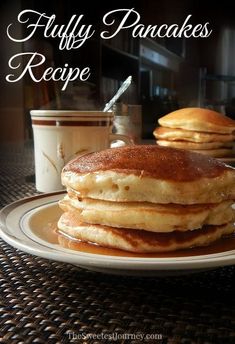 fluffy pancakes on a plate with syrup and coffee in the background, text reads fluffy pancakes recipe