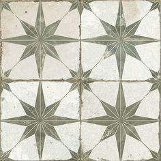 a white and gray tiled floor with star designs on the tiles in different sizes, shapes and colors