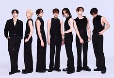 five male models in black clothing standing side by side with their hands on their hips