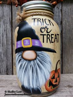 there is a painted mason jar with a trick or treat on it