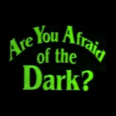 the words are you afraid of the dark? on a black background with green lettering