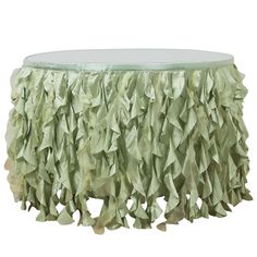 a round table covered in green tissue paper