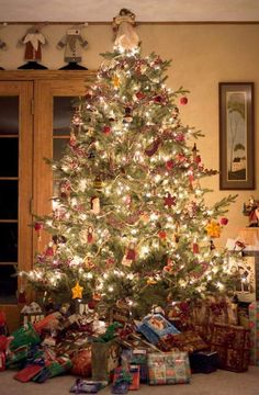 a christmas tree with presents under it