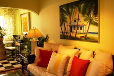 a living room filled with lots of furniture next to a checkerboard flooring