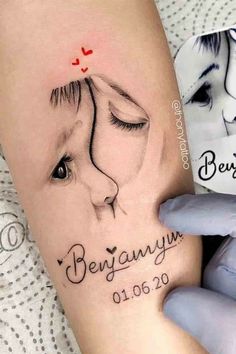 a woman's arm with a tattoo on it and the words besannyu written