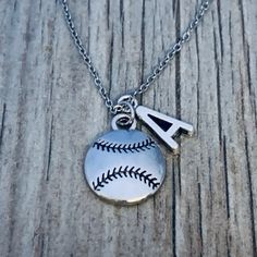 a baseball necklace with the letter a on it